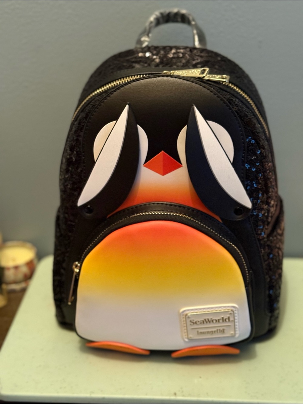 SeaWorld  Black Penguin Backpack with Orange Gradient Front